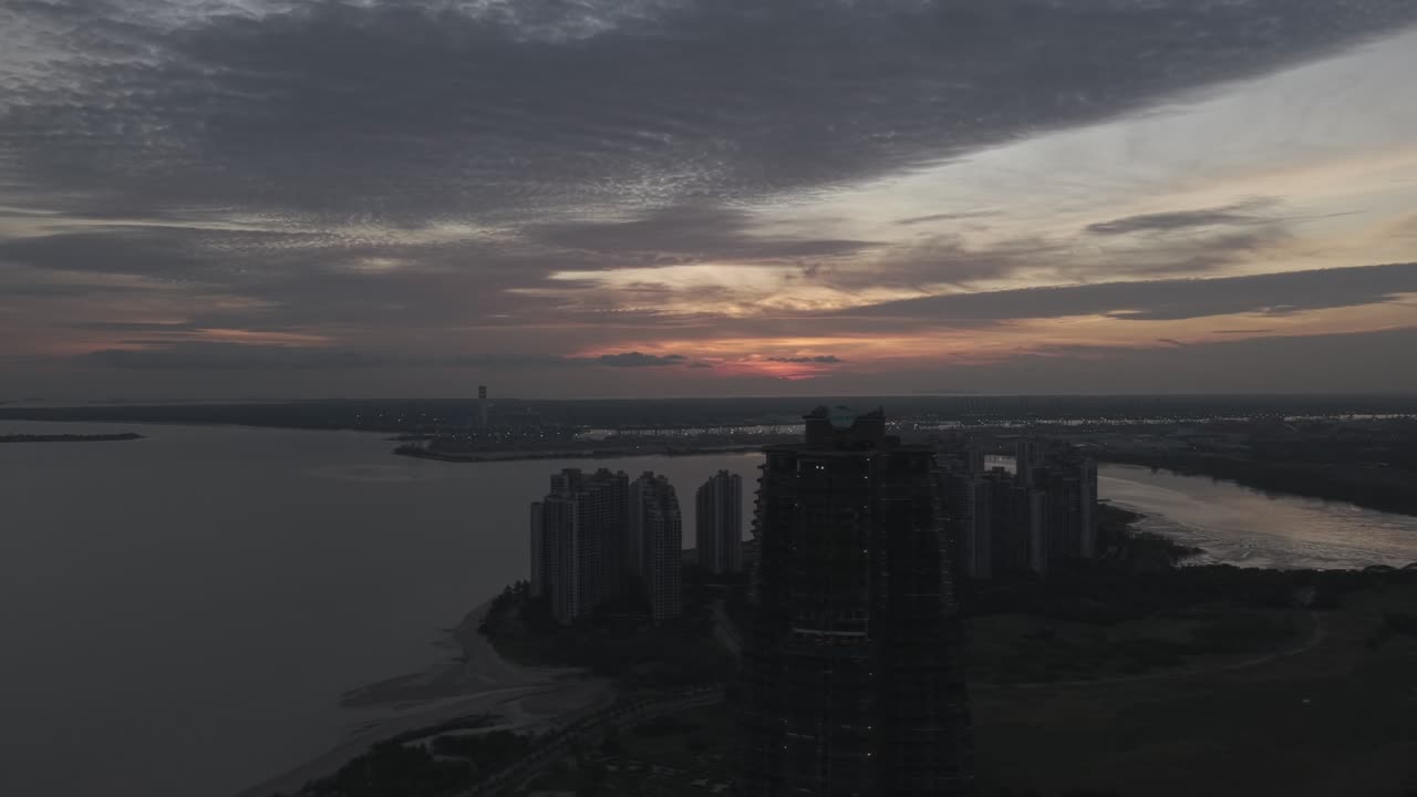 Drone shot of Forest City skyline at sunset with cinematic D-Log color