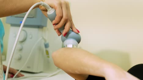 physiotherapist doctor performs surgery on a patient's hand