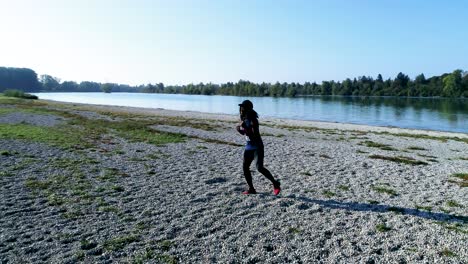 drone shot of young attractive black female doing sports outdoors