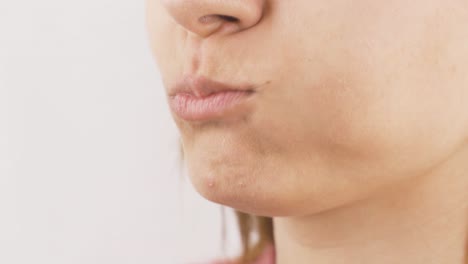 close-up portrait of woman eating red apple. eat fruit.