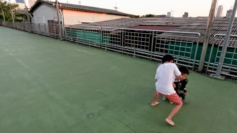 person practices roller skating with a friend's assistance