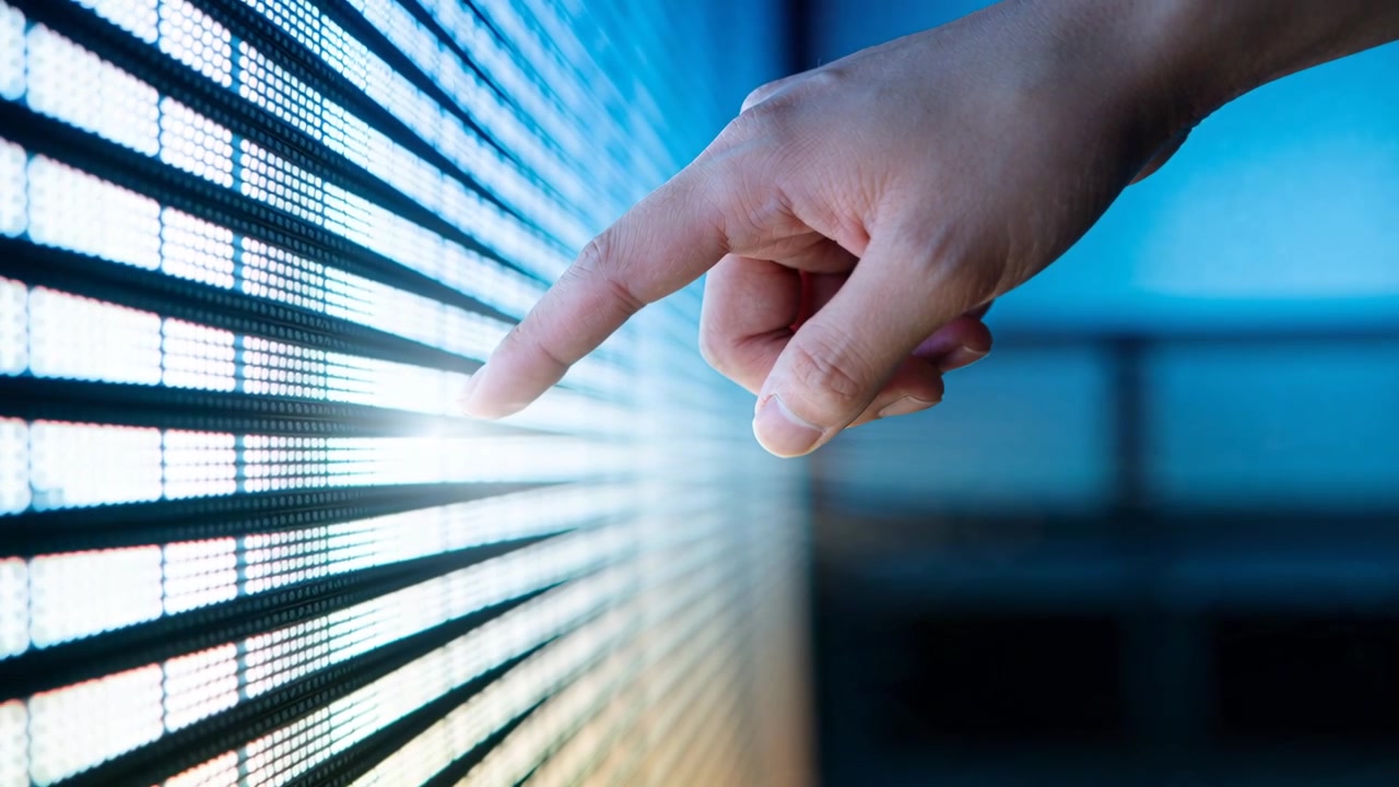 Reaching right hand, fingertip nearing lit row, tracing, tapping LED panel in test lab, copy space