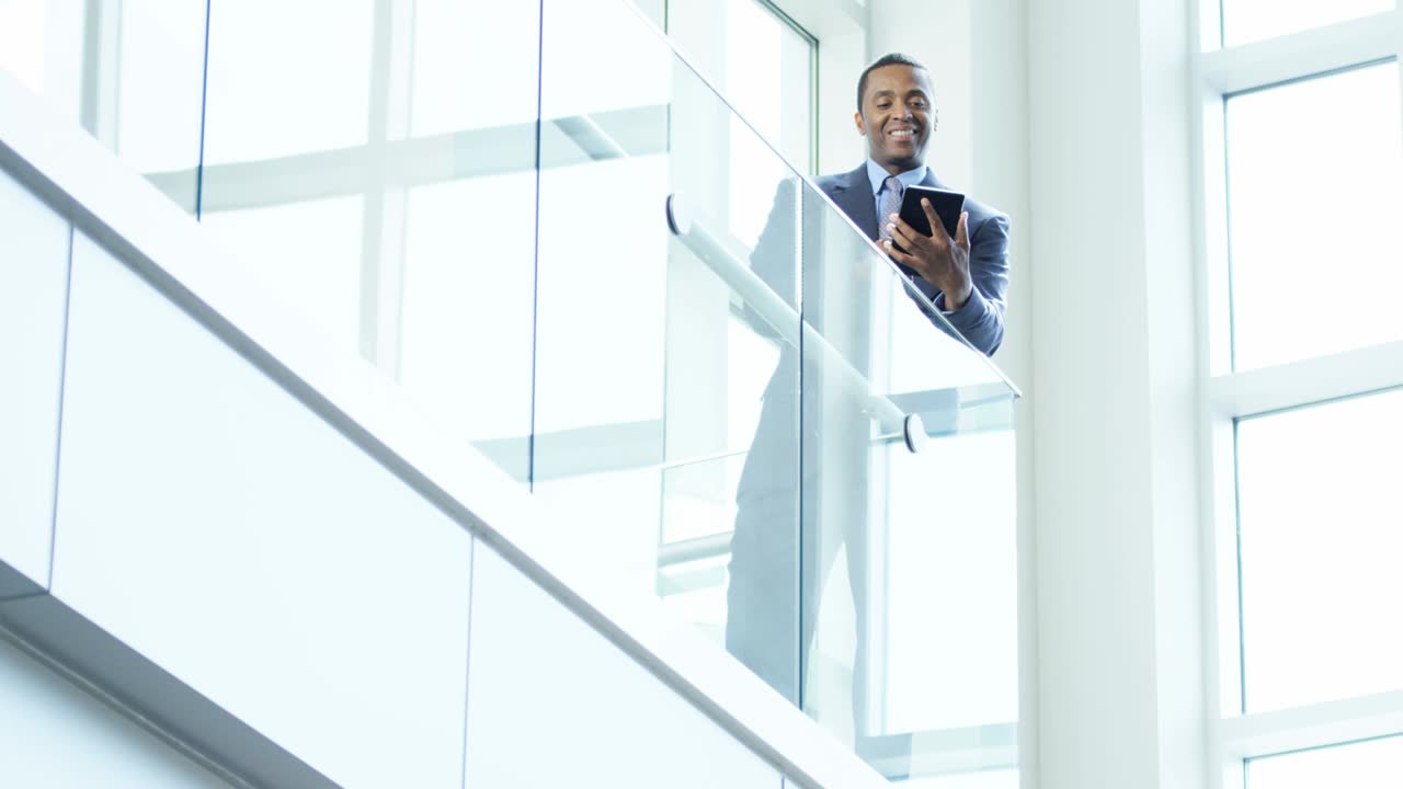 Male African American business manager using tablet technology