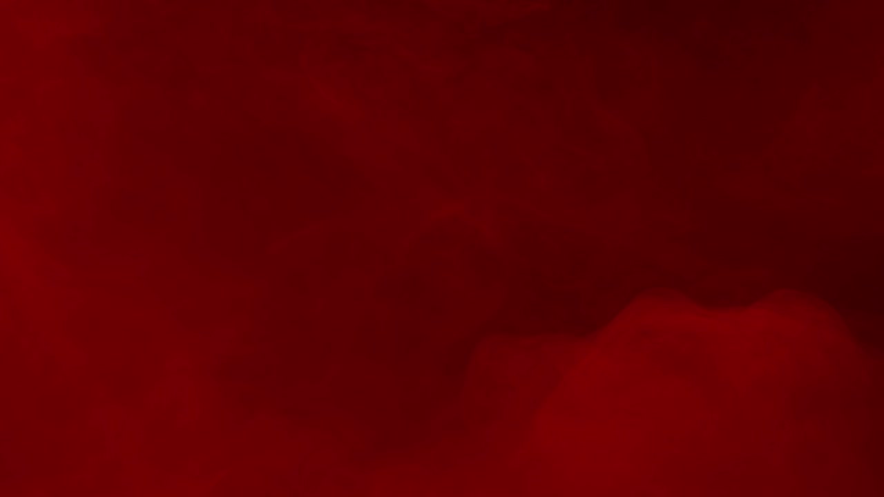 Thick and heavy red fog flows across the screen on a black background. A dramatic and atmospheric overlay for horror, mystery, or passionate visual themes