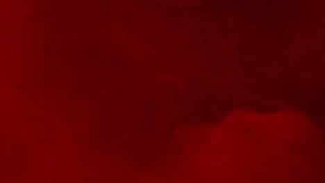 thick and heavy red fog flows across the screen on a black background. a dramatic and atmospheric overlay for horror, mystery, or passionate visual themes