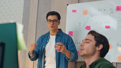 nervous guys discussing computer project closeup. two startupers brainstorming