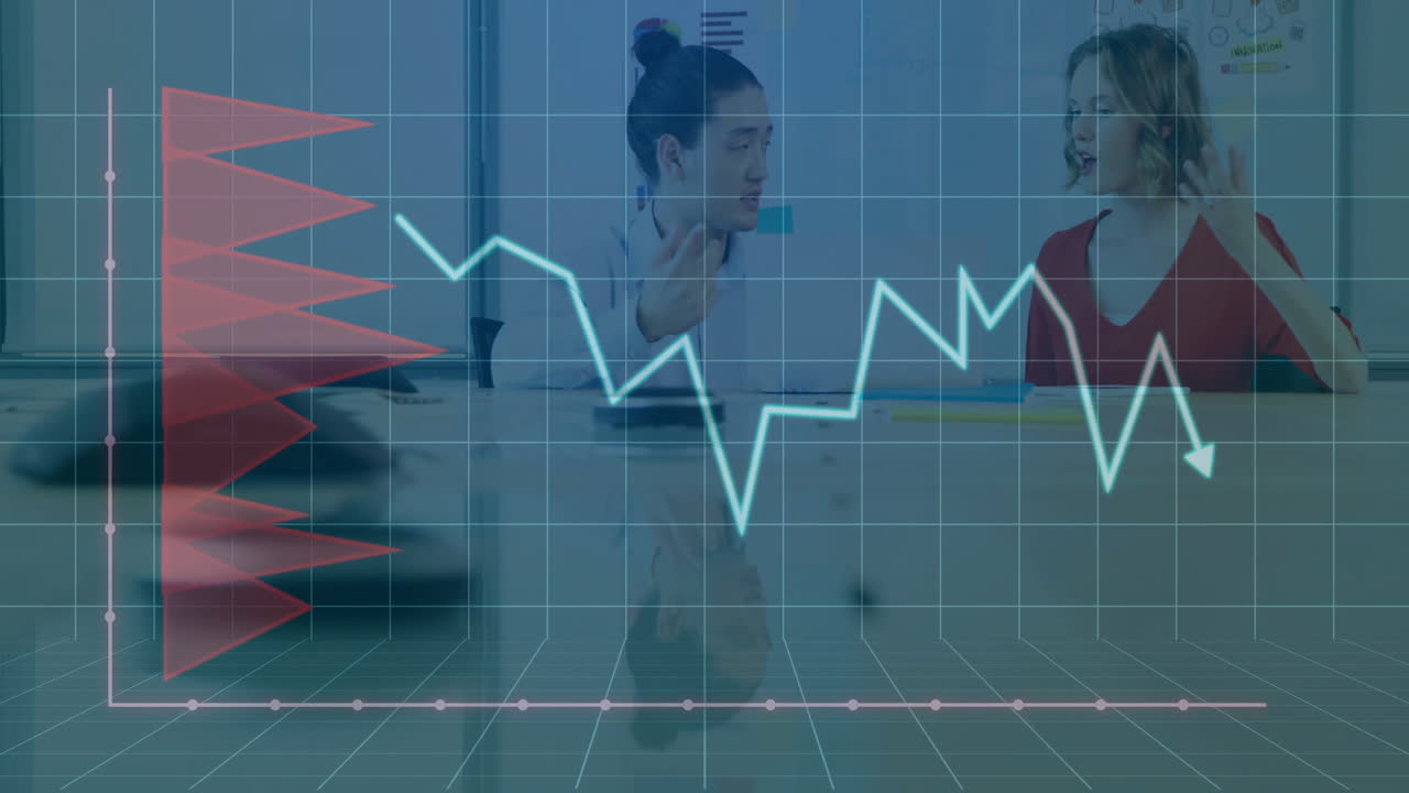 Two colleagues discussing finance at conference table, showing smartphone data with animated charts