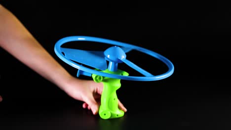 toy is launched using a pull string mechanism