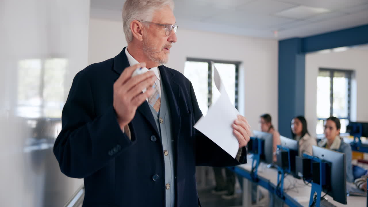 Teacher giving a lecture in a computer lab