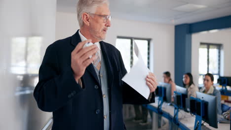 teacher giving a lecture in a computer lab