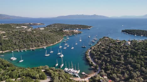 flyover sailboats moored in quiet protected bay on greek coastline