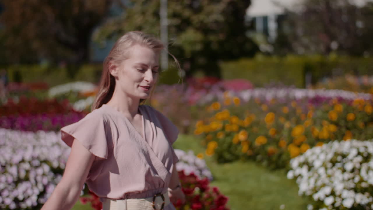 Woman Dancing Among Blooming Flowers Joyfully