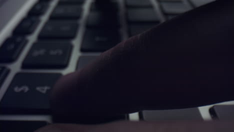 Man-hands-typing-on-laptop-keyboard.-Male-person-pressing-black-keys-on-laptop
