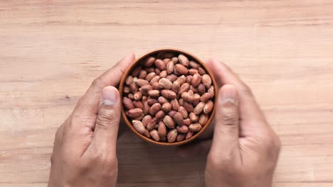 peanuts in a wooden bowl