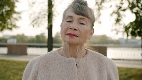 portrait of an elderly woman in a park