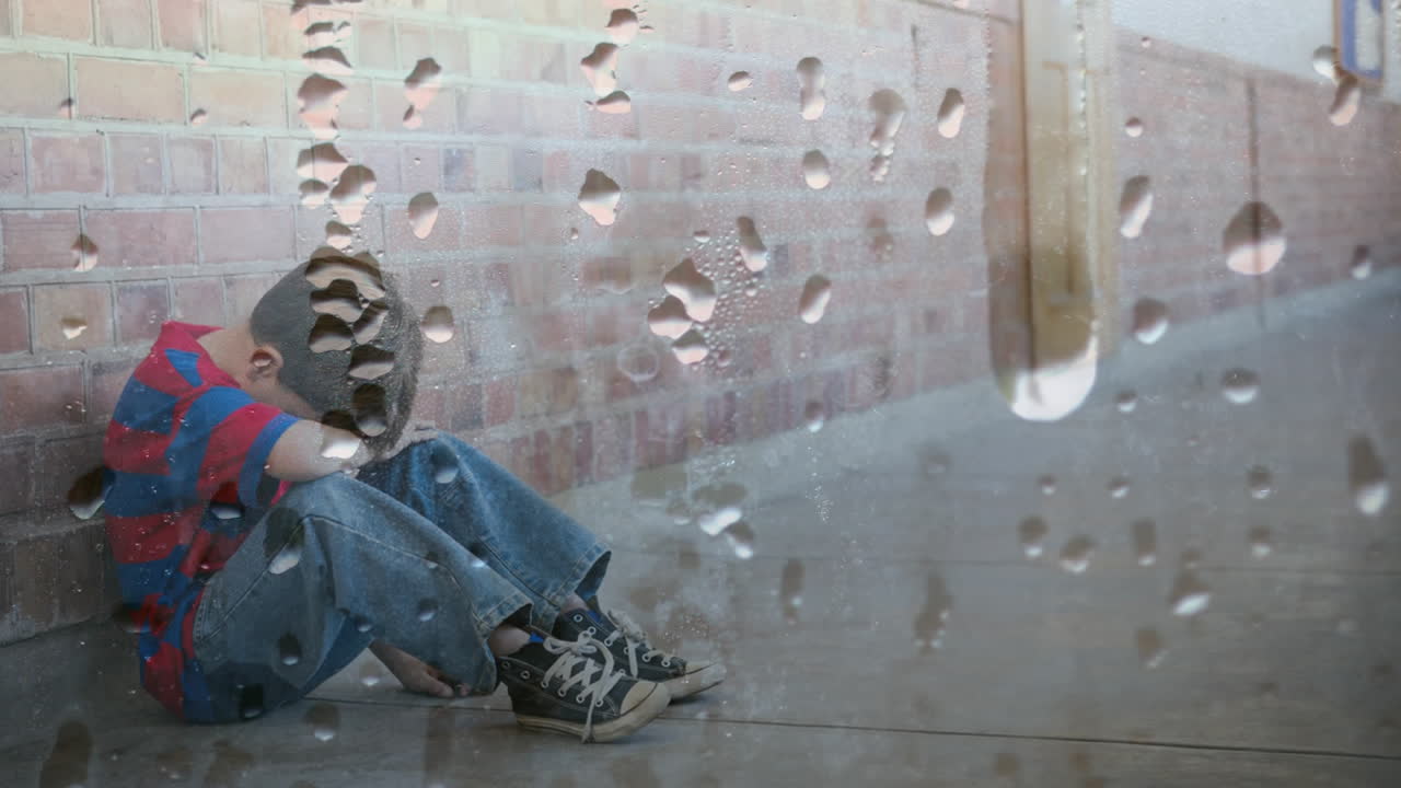 머리를 숙여 벽에 앉아 있는 화가 난 소년의 디지털 애니메이션 4k