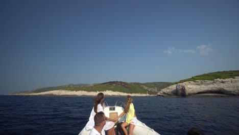 people on a boat trip on the sea with scenic islands