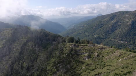 aerial view of a mountain through the clouds in italy