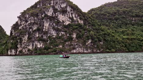 ragged peaks and a boat in the ha long bay national park in northeast vietnam