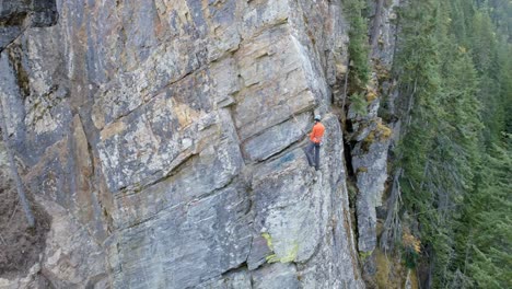 Climber-climbing-rocky-mountain-4k