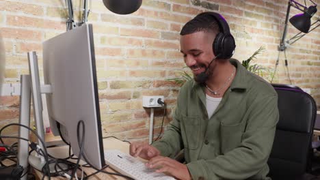 man working at a computer in an office