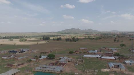 aerial - descending drone shot over scenic kassa town in plateau, nigeria