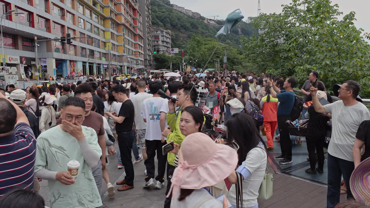 CHONGQING, CHINA - 28 MAY 2025 : train enters liziba station inside a building on bridge in Chongqing china