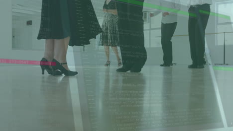 in office, people standing while computer code animation overlays their workspace
