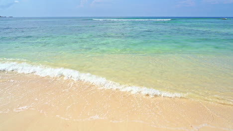 waves crashing on paradisiac beach. slow motion