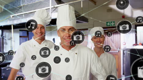 Animation of network of connections with icons over diverse cooks in kitchen