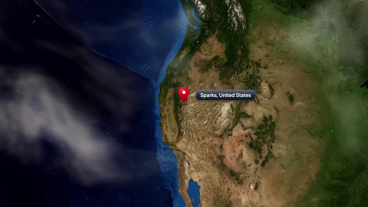 Satellite view camera zooms in from space to Sparks Nevada with a pinpoint marker. Includes NASA public domain imagery.