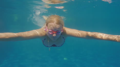 A-Woman-Is-Swimming-In-The-Pool-Underwater-Slowmotion-Video