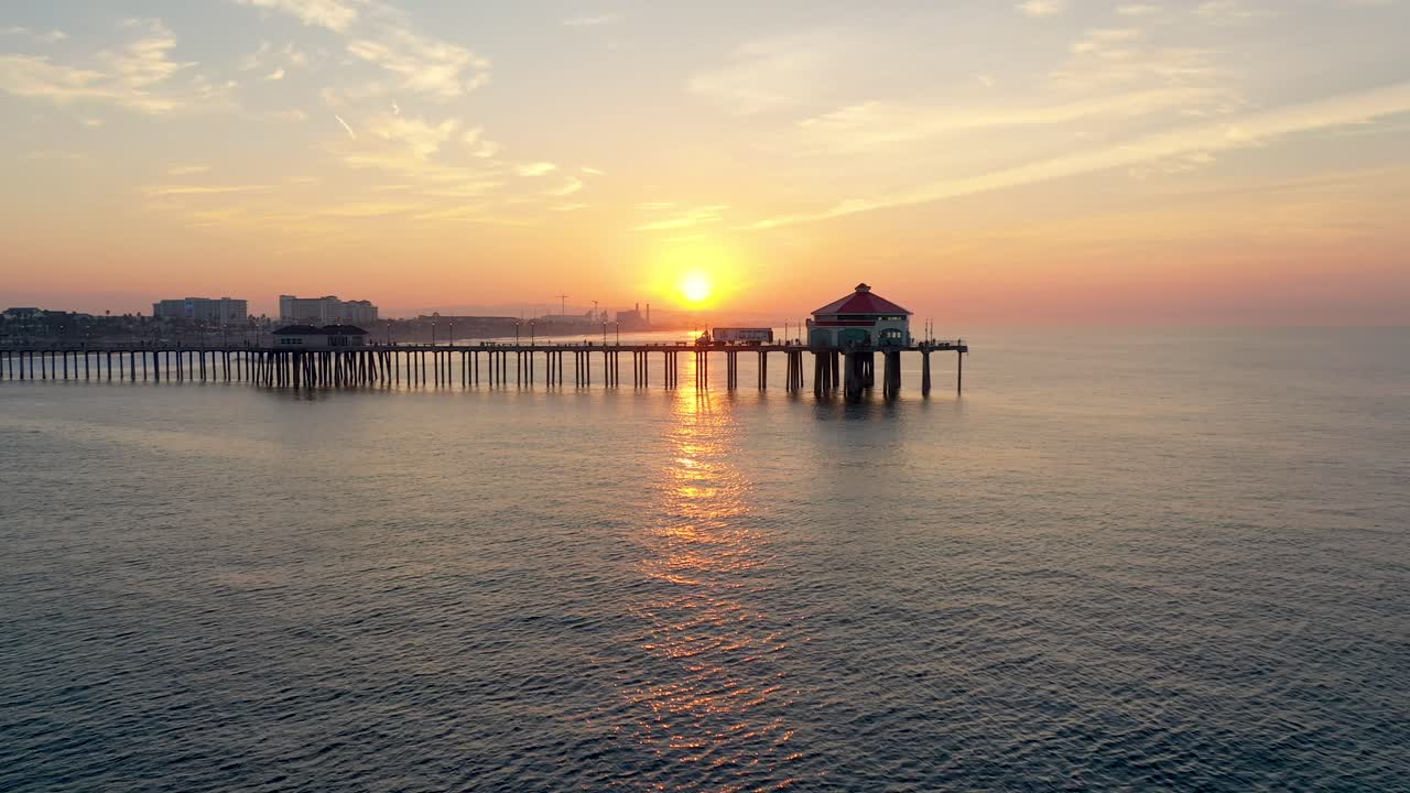 4k Ariel Drone shot of the Huntington Beach Pier in sunny Surf City California
