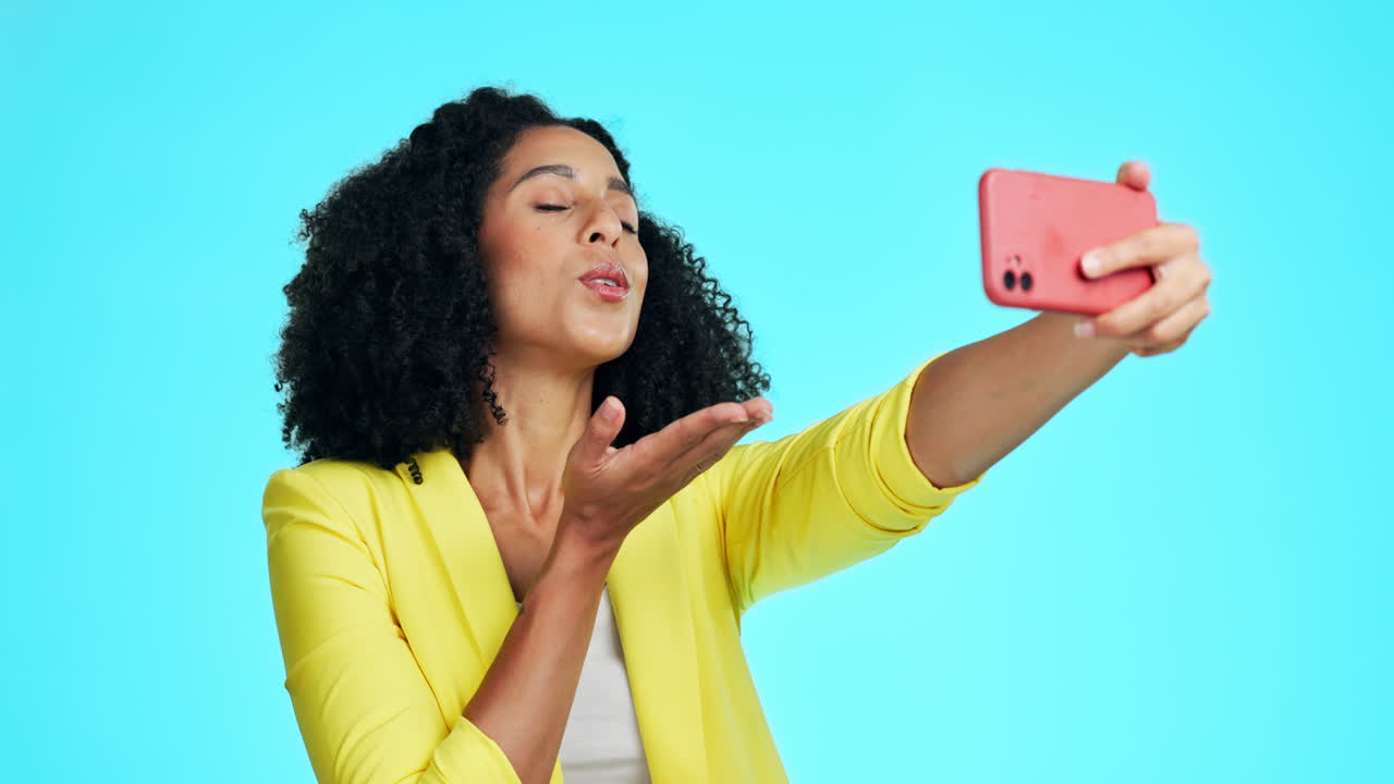 Kiss, peace sign and selfie of woman in studio