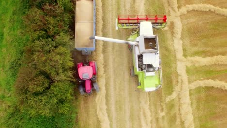 Drone-footage-combine-harvester-filling-in-trolley