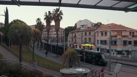 Two-trams-are-moving-in-opposite-directions,-view-from-above-,-Montpellier---France