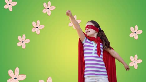 animation of girl in superhero costume over multiple flowers falling on green