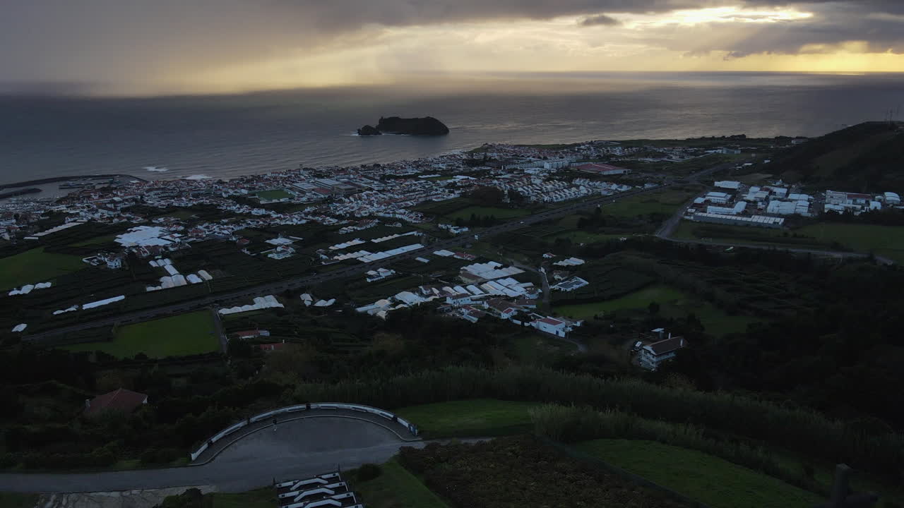 Aerial view of Chapel of Our Lady of Peace and Vila Franca do Campo during a beautiful sunset in Sao Miguel Island, Azores, Portugal