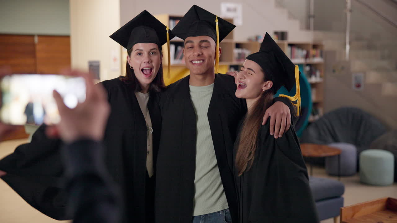 Graduating students celebrating with a photo