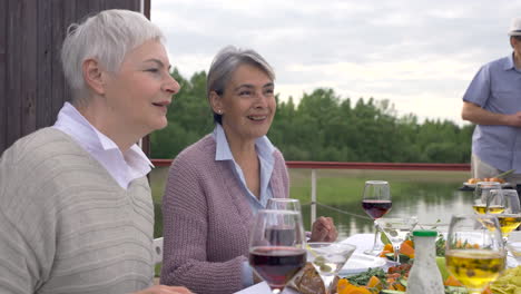 a group of senior people dining