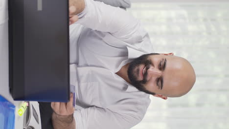 vertical video of home office worker man doing online shopping.