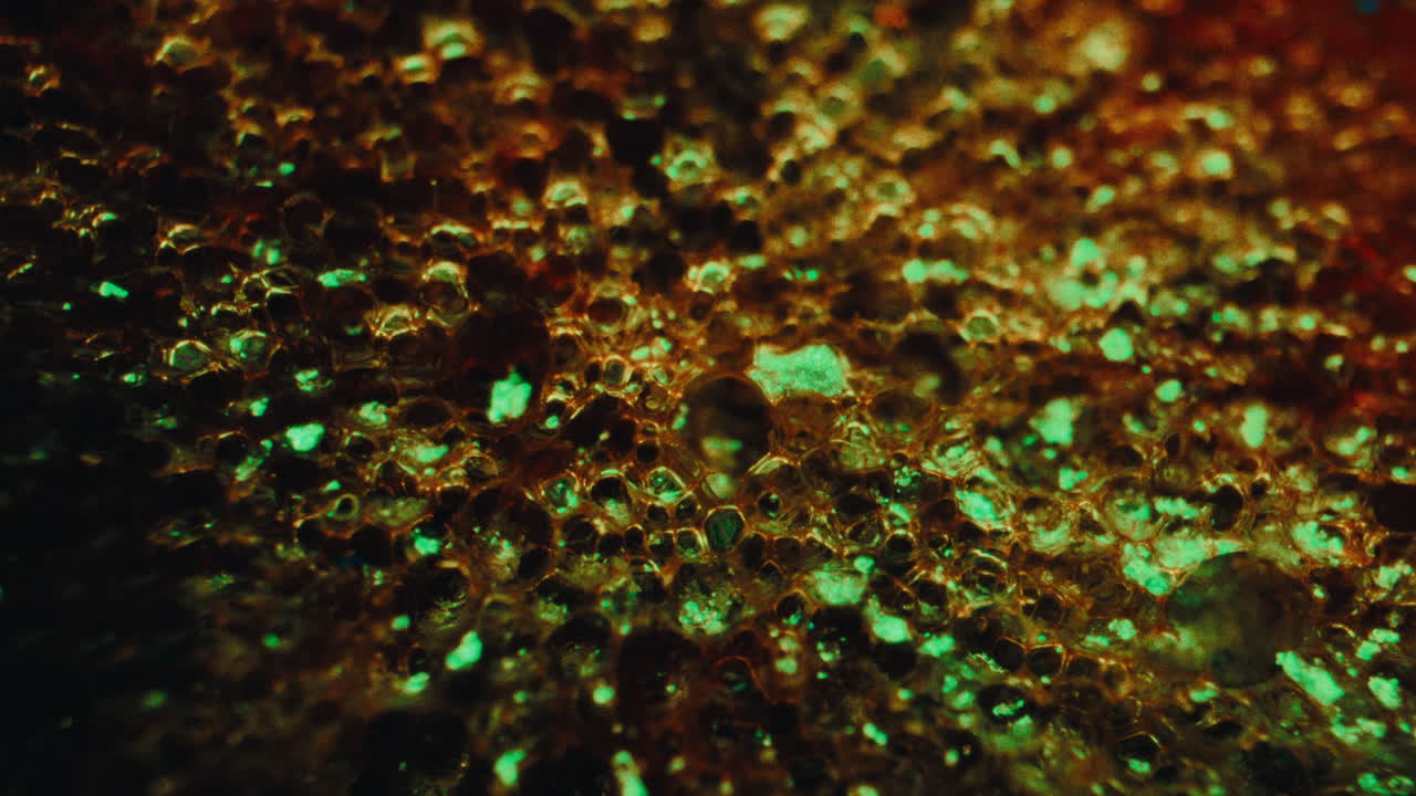 Close-up view of a porous, glowing material