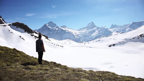 amused traveller admiring the beauty of grindelwald switzerland