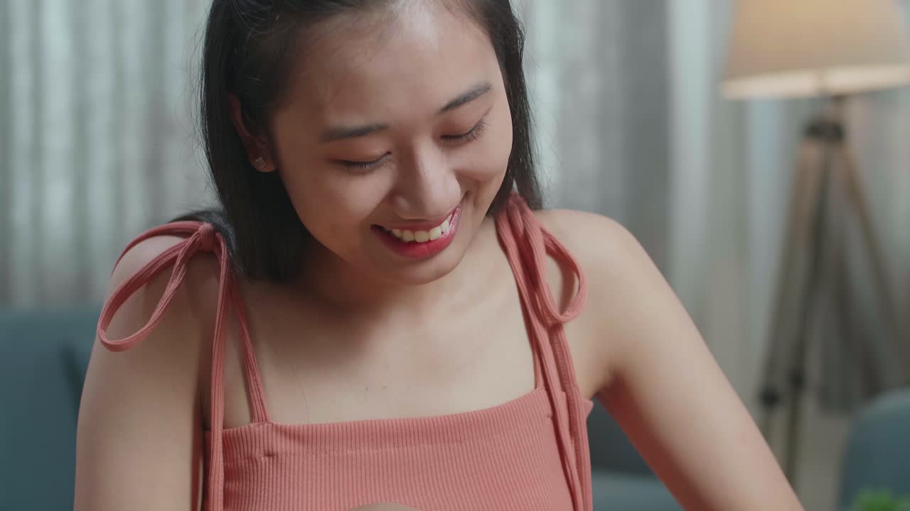 Young Woman Smiling with Cucumber and Thumbs Up