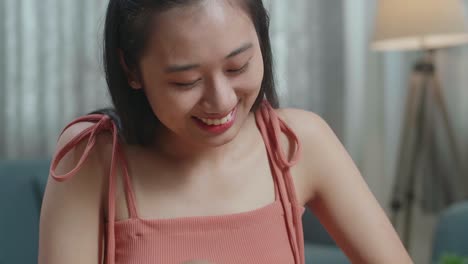 young woman smiling with cucumber and thumbs up