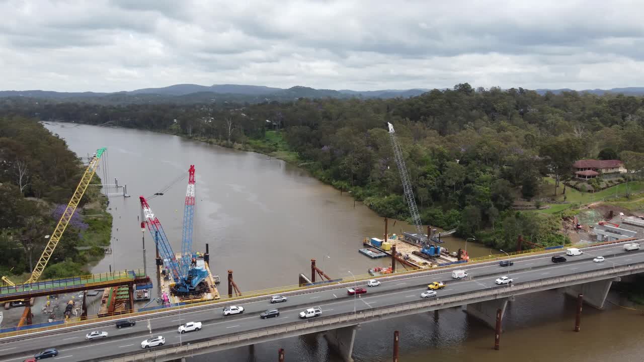 Aerial view of a new bridge construction next to an existing highway bridge
