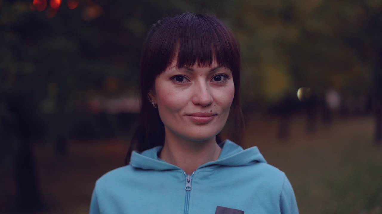 Woman in a Park at Dusk
