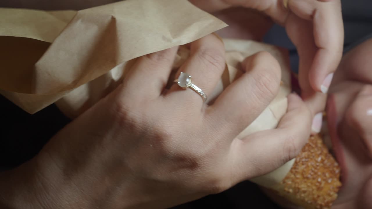 Close-up of person holding sandwich