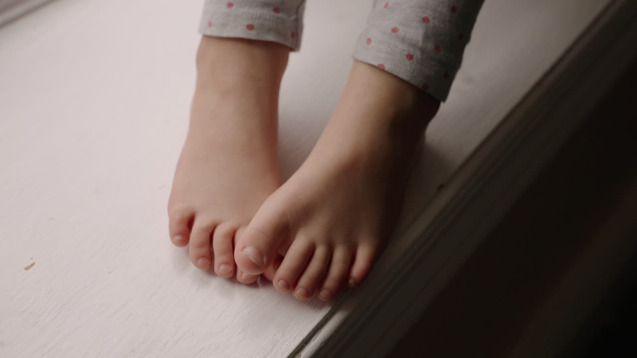A young child's resting barefeet