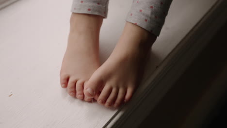 A young child's resting barefeet